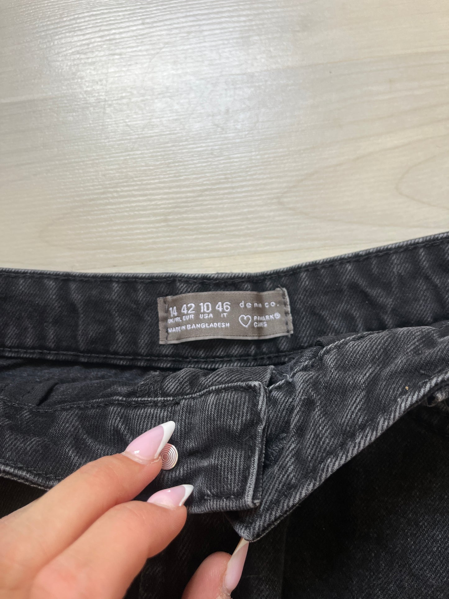 Mini jupe en jean noir effet déchiré - 42