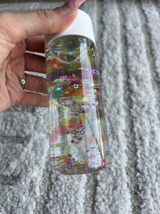 Bouteille sensorielle étoiles colorées l’Atelier Gigogne