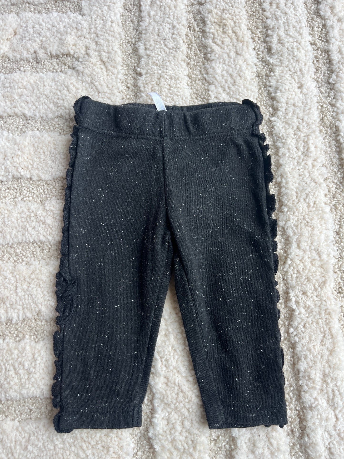 Legging en jersey noir à paillettes et détails lettuce sur les côtés - 1 mois