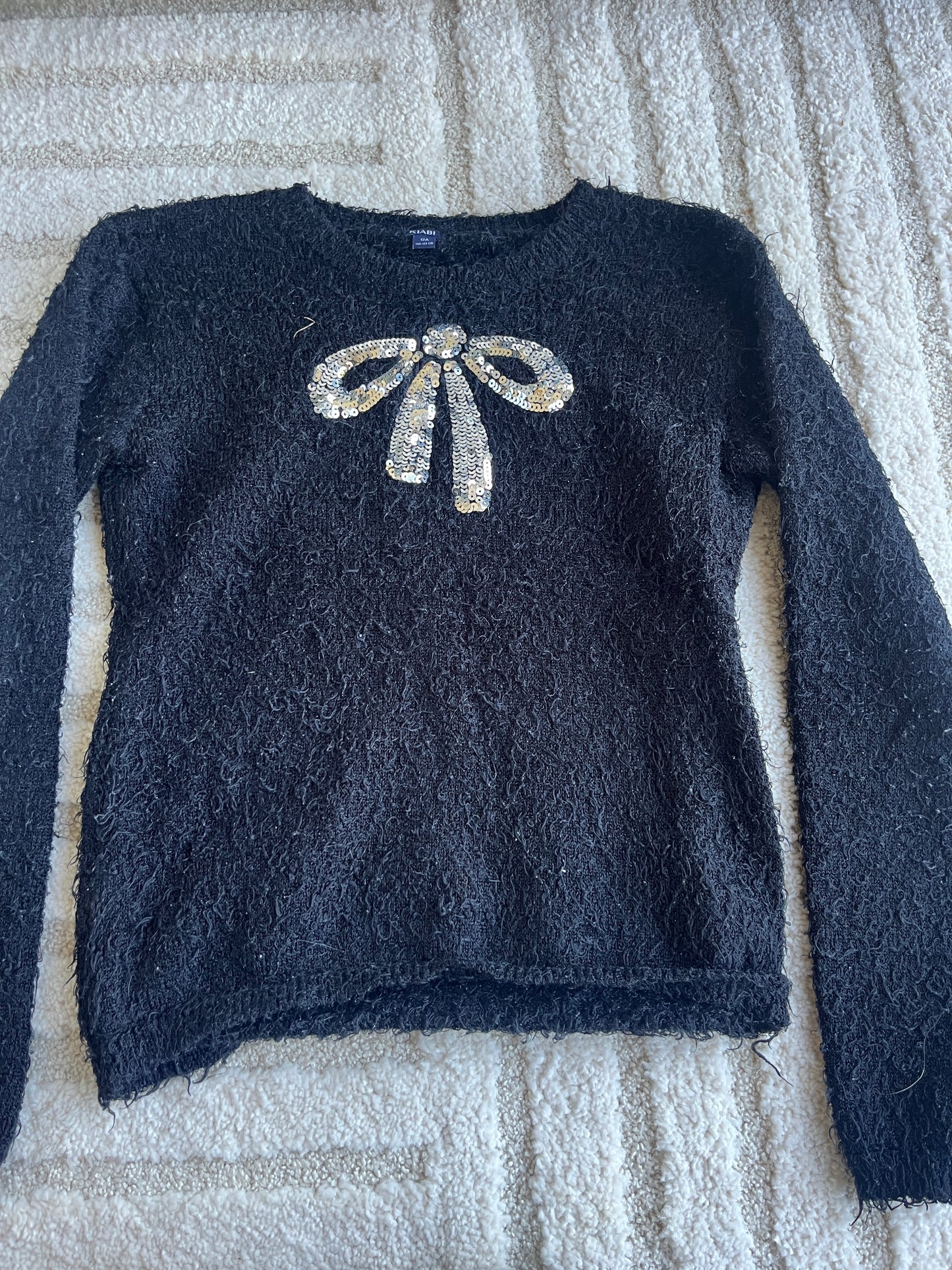 Pull à manches longues noir avec noeud argenté - 12 ans